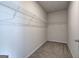 Walk-in closet with carpet flooring and wire shelving for storage at 158 Bryon Ln, Acworth, GA 30102