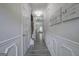 Elegant hallway with decorative wainscoting, hardwood floors, and recessed lighting at 158 Bryon Ln, Acworth, GA 30102