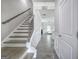Bright hallway with hardwood floors, wainscoting, and a staircase leading to the upper level at 158 Bryon Ln, Acworth, GA 30102