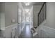 Long hallway featuring hardwood floors, wainscoting, multiple doors, and recessed lighting at 158 Bryon Ln, Acworth, GA 30102