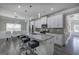 Bright kitchen with stainless steel appliances, a center island with bar seating, and hardwood floors at 158 Bryon Ln, Acworth, GA 30102