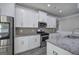 Well-equipped kitchen featuring stainless steel appliances, granite countertops, and ample cabinet space at 158 Bryon Ln, Acworth, GA 30102