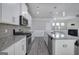 Open concept kitchen with granite countertops, stainless steel appliances, and a view to the fireplace at 158 Bryon Ln, Acworth, GA 30102