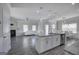 Open-concept kitchen with granite countertops, stainless steel appliances, and an island at 158 Bryon Ln, Acworth, GA 30102