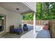 Covered outdoor patio with stylish furniture and a charming brick grill at 158 Bryon Ln, Acworth, GA 30102