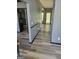 Spacious hallway featuring wood-look floors, neutral paint, and access to multiple rooms at 692 Sedgwick Dr, Jonesboro, GA 30238