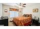 Comfortable carpeted bedroom with warm lighting, decorative accents, and ample natural light at 1017 Camelot Dr, Atlanta, GA 30349