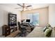 Functional bedroom with a ceiling fan, a bookshelf, and a desk area for a workspace at 1017 Camelot Dr, Atlanta, GA 30349