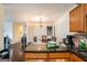 Inviting eat-in dining area, with hardwood floors and dining table under a decorative light fixture at 1017 Camelot Dr, Atlanta, GA 30349