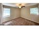 Neutral bedroom features two windows that provide lots of natural light and a ceiling fan at 3670 Broadview Ct, Decatur, GA 30032