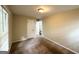 Neutral bedroom features a ceiling light, a window, and a closet for storage at 3670 Broadview Ct, Decatur, GA 30032
