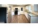 Bright kitchen with white cabinets, granite counters, and stainless steel appliances at 3670 Broadview Ct, Decatur, GA 30032