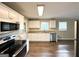 Modern kitchen featuring white cabinets, stainless steel appliances, and granite countertops at 3670 Broadview Ct, Decatur, GA 30032