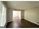 Bright living room featuring new wood floors and neutral paint at 3670 Broadview Ct, Decatur, GA 30032