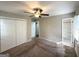 Main bedroom featuring a ceiling fan, closet, and an en-suite bathroom at 3670 Broadview Ct, Decatur, GA 30032