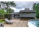 Well maintained backyard features a wooden deck, screened porch and above ground swimming pool at 123 Mill, Dallas, GA 30157