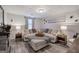 Finished basement Gathering room with stone fireplace and a comfortable sofa with ottoman at 123 Mill, Dallas, GA 30157
