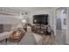 Finished basement Gathering room features a large TV and comfortable sitting area with ottoman at 123 Mill, Dallas, GA 30157