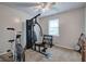 Bedroom with exercise equipment, window, ceiling fan and weights at 123 Mill, Dallas, GA 30157
