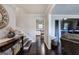 Inviting entryway featuring hardwood floors, a staircase, and a decorative console table at 123 Mill, Dallas, GA 30157