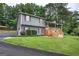 Lovely home featuring a large front yard, mature trees, and a charming front porch at 123 Mill, Dallas, GA 30157