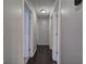 Long hallway with hardwood floors and access to multiple rooms at 123 Mill, Dallas, GA 30157