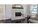 Cozy living room featuring a stone fireplace and dark hardwood floors at 123 Mill, Dallas, GA 30157
