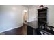 Office with dark wood floors and a vintage desk with built in shelving at 123 Mill, Dallas, GA 30157