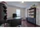 Office space with dark wood flooring, desk, and storage shelving at 123 Mill, Dallas, GA 30157