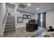 Finished basement office space featuring hardwood floors, an ornate desk, and a staircase at 123 Mill, Dallas, GA 30157
