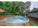 Backyard showing the above ground swimming pool with surrounding deck and fenced-in yard at 123 Mill, Dallas, GA 30157