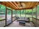 Enjoy nature views from the screened porch with a ceiling fan and comfortable outdoor furniture at 123 Mill, Dallas, GA 30157