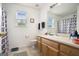 Bright bathroom featuring a window and neutral colors at 1765 Neighborhood Walk, Mcdonough, GA 30252