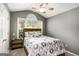 Bedroom with vaulted ceiling, ceiling fan, large window and carpet floors at 1765 Neighborhood Walk, Mcdonough, GA 30252