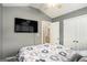 Bedroom featuring a television on the wall with access to the bathroom at 1765 Neighborhood Walk, Mcdonough, GA 30252