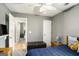Bedroom with an adjacent bathroom and an accent chair at 1765 Neighborhood Walk, Mcdonough, GA 30252
