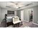 Primary bedroom featuring a tray ceiling, ceiling fan, and walk-in closet at 1765 Neighborhood Walk, Mcdonough, GA 30252