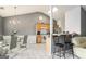 Open kitchen with stainless steel appliances, tile floors, breakfast bar, and vaulted ceilings at 1765 Neighborhood Walk, Mcdonough, GA 30252