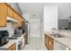 Bright kitchen with stainless steel appliances, tile flooring and convenient access to the backdoor at 1765 Neighborhood Walk, Mcdonough, GA 30252