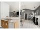 Kitchen sink and bar adjacent to an open living room at 1765 Neighborhood Walk, Mcdonough, GA 30252