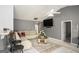 View of a living room with neutral colors, a large sectional sofa, and bar seating at 1765 Neighborhood Walk, Mcdonough, GA 30252