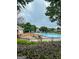 A refreshing community pool surrounded by lush landscape, lounge chairs, and a secure fence at 1765 Neighborhood Walk, Mcdonough, GA 30252