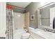 Neutral bathroom featuring a shower and tub combination, with gray walls and a mirror at 1386 Sheffield Glen Ne Way, Atlanta, GA 30329
