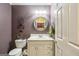 Charming powder room with a vanity and a decorative mirror at 1386 Sheffield Glen Ne Way, Atlanta, GA 30329