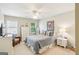 Cozy bedroom with a ceiling fan, a large bed with pillows and a dresser at 1386 Sheffield Glen Ne Way, Atlanta, GA 30329