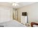 This bedroom boasts carpet, a ceiling fan, closet, and TV at 1386 Sheffield Glen Ne Way, Atlanta, GA 30329