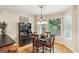 Cozy dining area with chandelier, bay window, and wood flooring at 1386 Sheffield Glen Ne Way, Atlanta, GA 30329