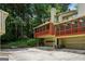 Back exterior of a condo, with a garage, and a screened in porch at 1386 Sheffield Glen Ne Way, Atlanta, GA 30329