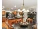 Spacious kitchen with wood cabinets, black countertops, and island seating at 1386 Sheffield Glen Ne Way, Atlanta, GA 30329