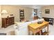 Open layout living room with carpet, a ceiling light, tables, lamps and a sofa at 1386 Sheffield Glen Ne Way, Atlanta, GA 30329